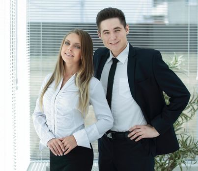 business couple standing in a modern office.photo with copy space