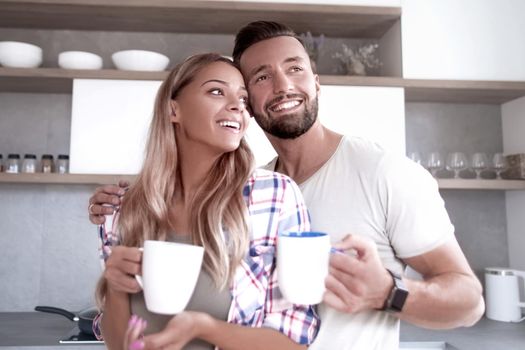 close up. young couple in love in the kitchen in a good morning