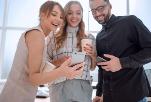 business team reading emails on their smartphones. people and technology