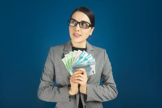 Woman with tenge dreamily looks to the side.