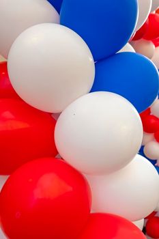 Red, white and blue balloons, the colors from the dutch flag at Kings Day in Amsterdam the Netherlands