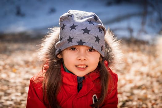 Outdoor portrait of 5 y.o. girl in autumn sunny day.