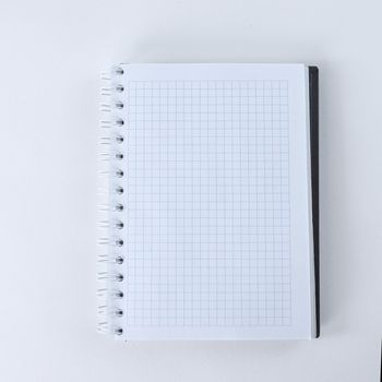blank sheet of notebook isolated on a white background.photo with copy space.