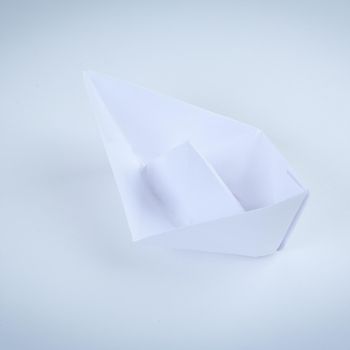 paper boat made in the technique of origami. .photo with copy space