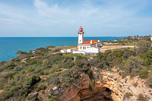 Aerial from lighthouse farol de Alfanzina on a cliff in the Algarve Portugal