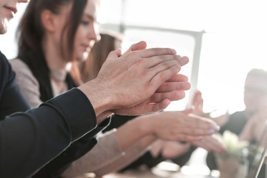 Business people clapping and applause at meeting or conference, close-up of hands.