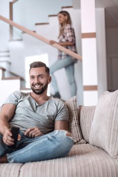 close up. young man sitting on sofa. photo with copy space