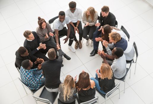 Groupmates listening to lecturer or speaker at conference