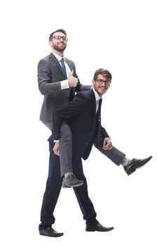 smiling businessman sitting on the back of his colleague . isolated on white background.