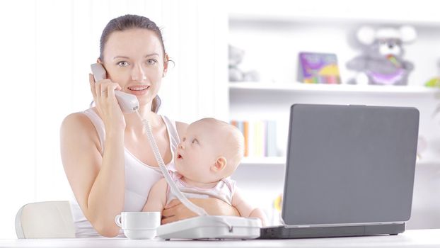 modern young mother talking on the phone. the concept of freelancing