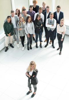 top view. female leader standing at the front of the business team . business concept