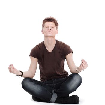 momodern guy meditates sitting on the floor.isolated on white background