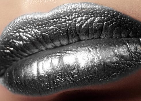 Closeup Female Plump Lips with Silver Color Makeup. Fashion Celebrate Make-up, Glitter Cosmetic. Christmas Metalic Style. New Year Celebrate Lip Makeup
