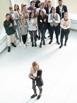 top view. female leader standing at the front of the business team . business concept