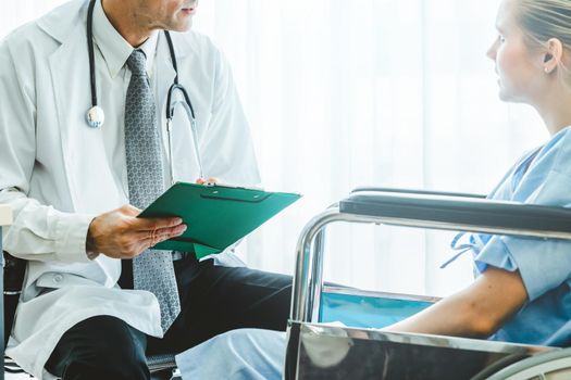 Doctor in professional uniform examining patient at hospital or medical clinic. Health care , medical and doctor staff service concept.