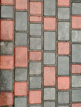 Texture of wet paving slabs with little bit green grass