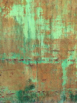 Corroded metal background. Rusted white painted metal wall. Rusty metal background with streaks of rust. Rust stains. The metal surface rusted spots. Rystycorrosion.