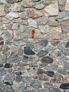 Background of large stones wall texture with different colors stones