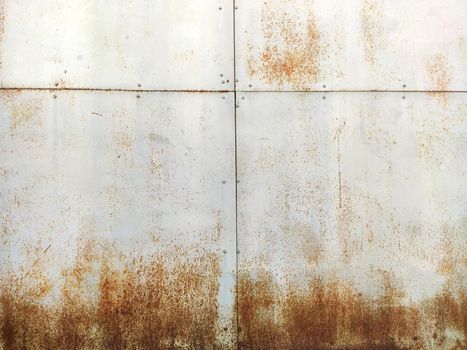 Rusty corrosion and oxidized background. Grunge rusted metal texture background. High resolution image of oxidized iron steel sheet wall.