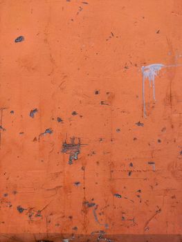 Orange Texture old wall background with peeling paint, scratches and cracks