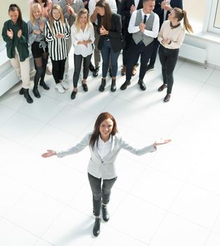 top view. female leader standing at the front of the business team . business concept