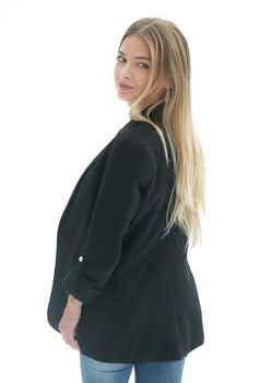 rear view. a young woman in a black blazer, looking at the white wall. isolated on white