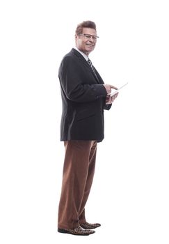 in full growth. happy business man with a digital tablet . isolated on a white background