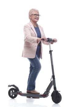 in full growth. happy adult woman with electric scooter. isolated on a white background