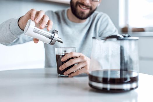 close up. sugar container with a dispenser in the hands of a man. photo with copy space