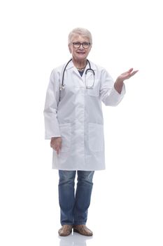in full growth. Mature woman doctor showing on blank screen . isolated on a white background
