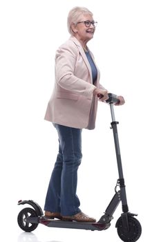 side view. modern elderly woman with electric scooter. isolated on a white background