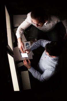 top view .business colleagues using gadgets to work with financial data.business and technology