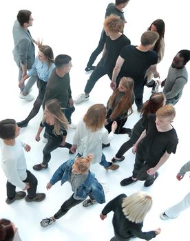 top view . groups of young people walking in different directions. photo with copy space