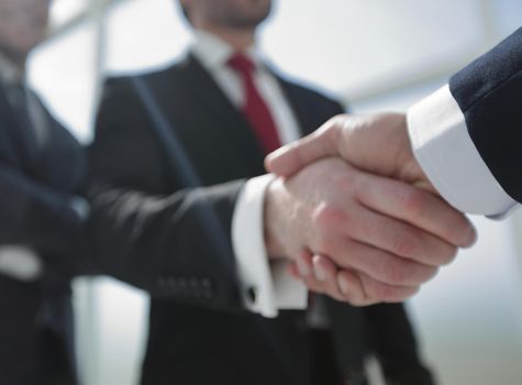 business background.business handshake.the concept of cooperation