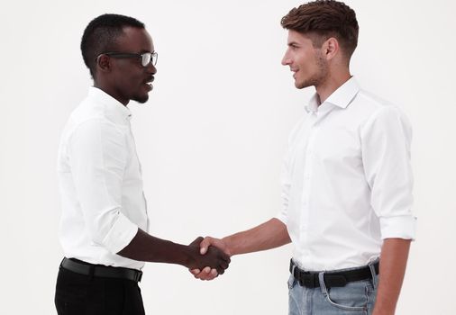 young business partners shaking hands.the concept of cooperation