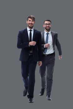 in full growth. two businessmen stepping forward. isolated on white background