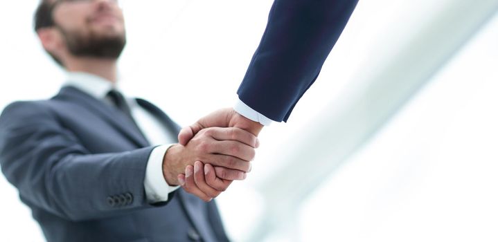 Close-up of two men hands shaking after signing contract