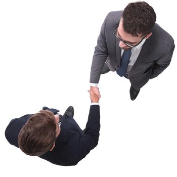 top view. business people shaking hands. isolated on white background