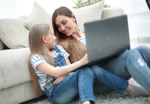 mother and daughter spend their free time together.people and technology