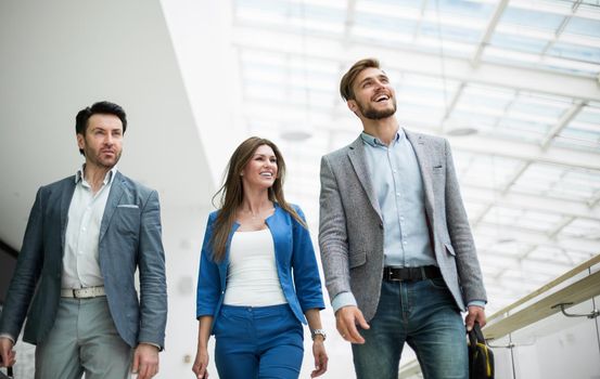 smiling staff walking in the business center.photo with copy space