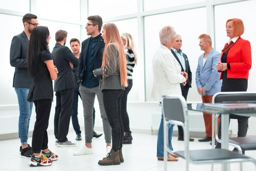 Office workers in a modern lobby, group portrait