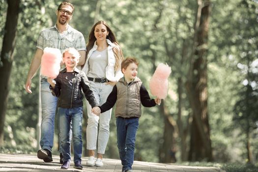 happy family standing in city Park.the concept of family entertainment