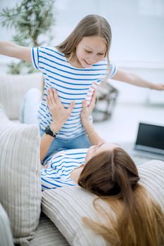 close up.happy mom and daughter play together.the concept of children's happiness