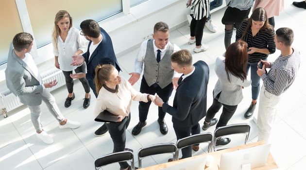 top view. a group of employees discussing work issues . business concept