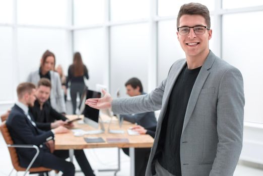 smiling businessman holding out his hand for a handshake. photo with a copy-space