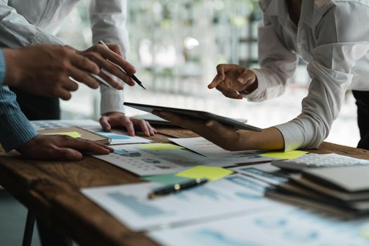 Asian business adviser meeting to analyze and discuss the situation on the financial report in the meeting room.Investment Consultant, Financial advisor and accounting concept.