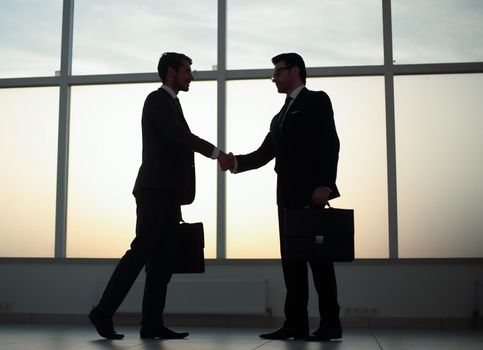 two business people holding out their hands for a handshake.photo with copy space