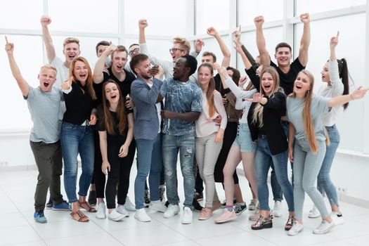 team of happy young people showing their success. photo with copy space