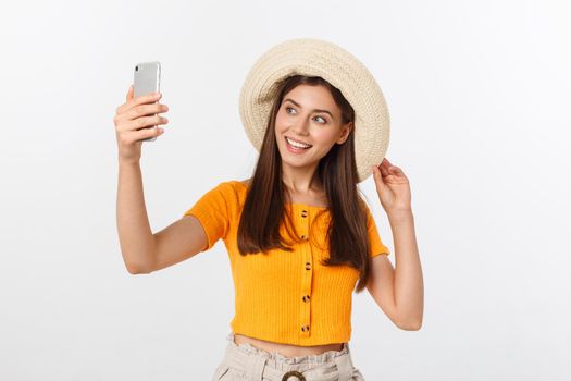 Young Caucasian woman enjoying the selfie with herself isolated on white background summer travel concept