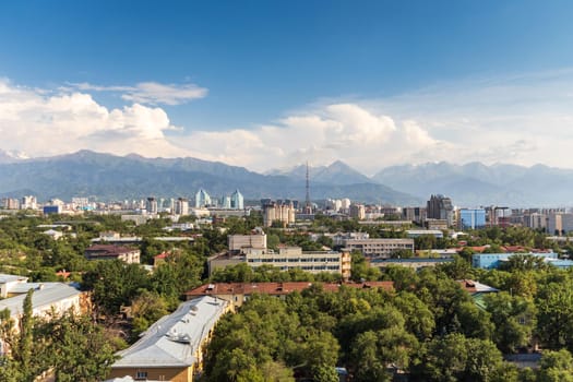 Aerial view of the Almaty courtyards surrounded by greenery in the city center. Almaty, Kazakhstan - July 02, 2021